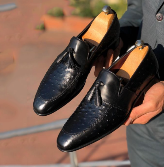 New black leather tassel loafers